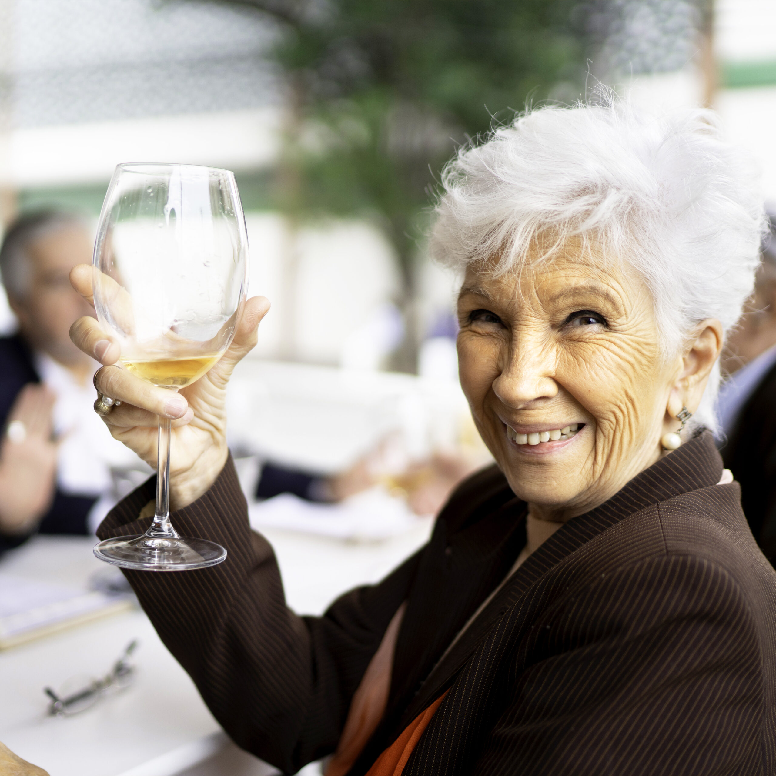a person holding a wine glass