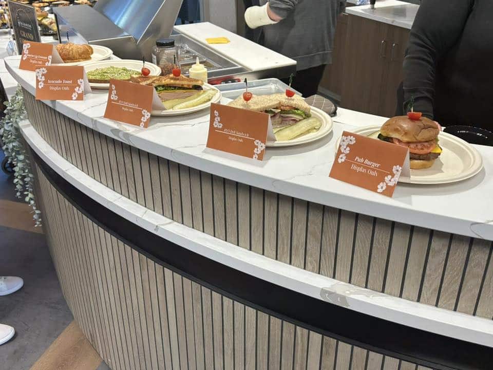 a person sitting at a table eating food a person sitting at a table eating food