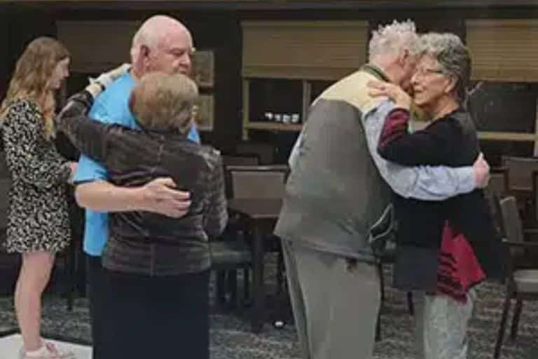 a group of people standing in a room
